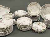 a lot of plates that are sitting on a table