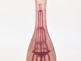 a pink glass vase with a birdcage on it