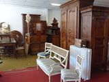 a room filled with furniture and a baby crib in it