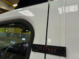 a close up of a car with a ruler on the side of it