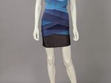 a mannequin wearing a blue and black dress on a mannequin mannequin