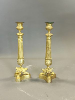 pair of antique brass candlesticks with green glass top