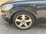 a close up of a car tire on the road