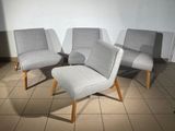 three chairs and a foot stool in a room with tile flooring