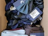 a cardboard box full of men ' s clothing and ties