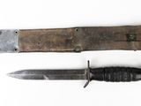 two different types of knives on a white surface
