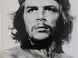 an old black and white photo of a man in a military uniform