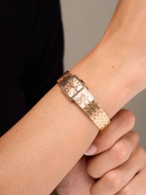 a close up of a person ' s wrist with a watch on it