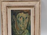 tableau représentant un jeune homme, dans un cadre blanc sur fond blanc