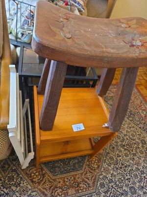 a small table with a wooden stool on top of it