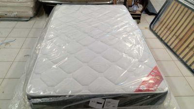 a mattress that is sitting on the floor in the store