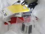 a pile of assorted items sitting on a bed