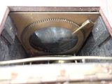 a metal box with a hole in it that has a hole in it