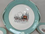 a plate with a picture of a horse drawn carriage on it