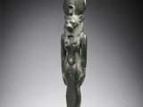 an egyptian bronze figure of a woman