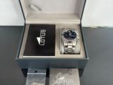 lotus watch in a box with a card and a watch in it