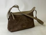 a small brown bag with a strap and a handle on a white background
