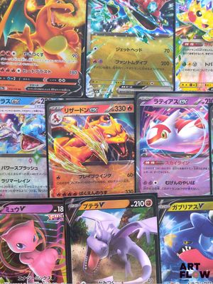 a lot of pokemon cards that are on the table