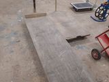 several pieces of wood are sitting on the floor of a building