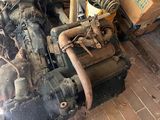 an old engine that is sitting on the ground