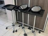 two trays of food sitting on a stand in the bathroom