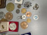 a lot of coins and other items on the table