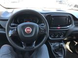 the interior of a car with a steering wheel and dashboard controls