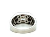 silver ring with a diamond in the middle of it