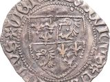 un gros plan d'une pièce d'argent sur laquelle figure un blason