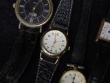 several different types of watches are displayed in a display case