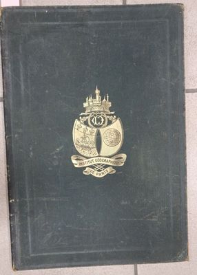 a black book with a gold emblem on it