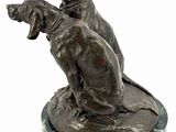 bronze statue of two dogs sitting on a marble base