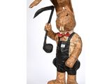 an image of a wooden sculpture of a rabbit with a pipe in his hand