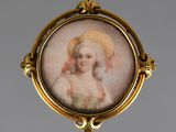 portrait of a woman in a bonnet in a gold broochle