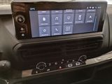 the dashboard of a car with a large screen on it