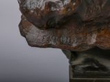 a statue of a dog that is sitting on top of a table