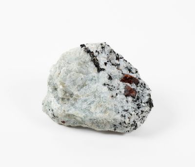 a close up of a rock that is on a white surface
