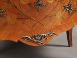 a chest of drawers that has a floral design on it