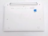 a white laptop with a blue sticker on top of it