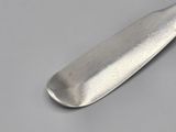 a knife that is laying on a table