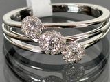 three diamond rings sitting on top of each other