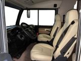 a view of the inside of a vehicle with the driver ' s seat up
