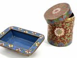an image of a blue and red box with a flower design on it