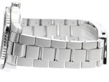 a silver watch that is sitting on a white surface
