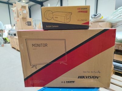 two boxes of televisions stacked on top of each other