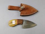 two knives that are sitting on a table