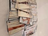 a lot of books that are stacked up on a wall