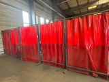 a group of red privacy screens in a warehouse