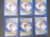 six pokemon cards are sitting on a table next to each other