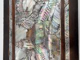 a picture of a stained glass picture hanging on a wall